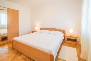 Posteľ alebo postele v izbe v ubytovaní Apartments Ana S