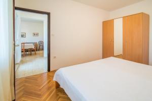 Posteľ alebo postele v izbe v ubytovaní Apartments Ana S