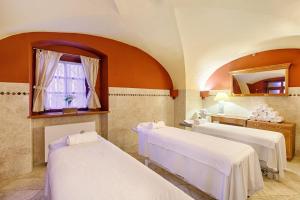 Postel nebo postele na pokoji v ubytování Hotel Hoffmeister