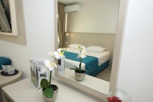 Postel nebo postele na pokoji v ubytování Hotel Delfin