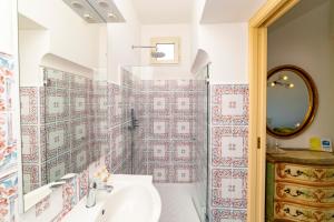 a bathroom with a sink and a shower at Casa Teresa in Positano +37 photos