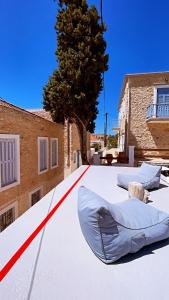 a white roof with a red line on it at Villetta Erato,picturesque studio in Chalki in Halki