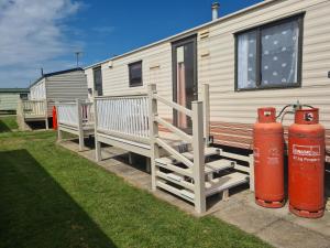 a trailer with two fire hydrants next to a house at 6 Berth Panel heated on Sealands Baysdale in Ingoldmells