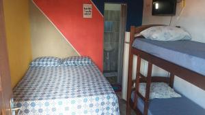 Letto o letti in una camera di Pousada Aconchego