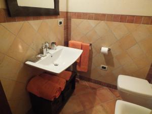 a bathroom with a sink and a toilet at Il Picco in Dronero