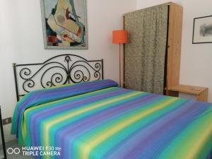 Katil atau katil-katil dalam bilik di Bilocale Rivabella