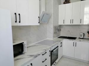 Kjøkken eller kjøkkenkrok på Комплекс апартаментов комфорт