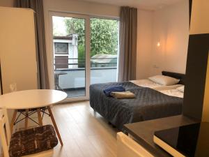 Posteľ alebo postele v izbe v ubytovaní Apartamenty "NaLetniej" Przy Morzu