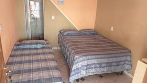 Letto o letti in una camera di Pousada Aconchego