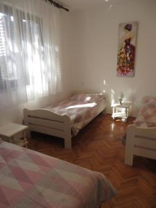 Posteľ alebo postele v izbe v ubytovaní Apartments Amfa