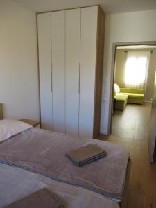 Posteľ alebo postele v izbe v ubytovaní Apartments Amfa