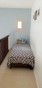 En eller flere senge i et værelse på Cookie Gite 6/7 personnes proche Zoo Beauval
