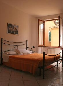 A bed or beds in a room at AFFITTACAMERE DAVIDE