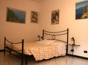 A bed or beds in a room at AFFITTACAMERE DAVIDE