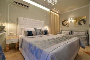 Posteľ alebo postele v izbe v ubytovaní Epavlis Luxury apts
