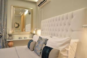 Posteľ alebo postele v izbe v ubytovaní Epavlis Luxury apts