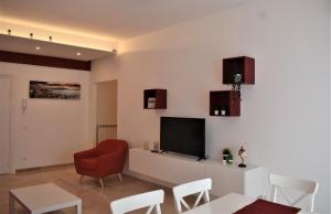 A television and/or entertainment centre at Melograno Home