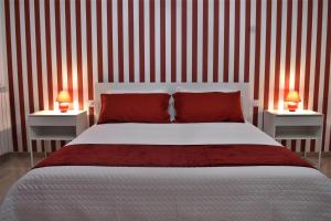 A bed or beds in a room at Melograno Home
