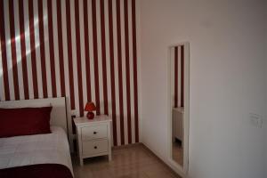 A bed or beds in a room at Melograno Home
