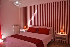 A bed or beds in a room at Melograno Home