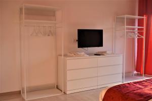 A television and/or entertainment centre at Melograno Home