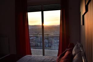 A bed or beds in a room at Melograno Home