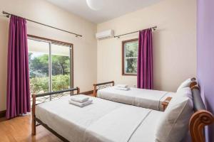 Postel nebo postele na pokoji v ubytování Zizi Sea View Villa