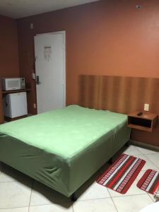 En eller flere senge i et værelse på Flat thermas place - caldas novas