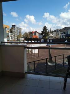 a balcony with a view of a parking lot at Apartamenty Zofia 1 in Władysławowo