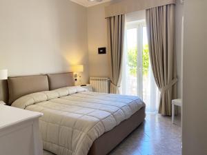 Postel nebo postele na pokoji v ubytování Hotel Ristorante Colleverde