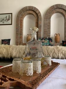 a glass cloche on a tray on a table at Hotel Berati in Berat