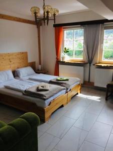 a bedroom with a large bed in a room with windows at Neckarblick,Natur, Altstadt in Hirschhorn