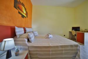 Postel nebo postele na pokoji v ubytování B&B La Casa di Attilio