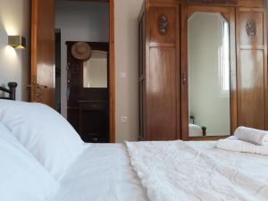 A bed or beds in a room at Mid century character house in Argostoli