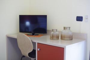 TV a/nebo společenská místnost v ubytování B&B La Casa di Attilio