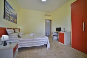 Postel nebo postele na pokoji v ubytování B&B La Casa di Attilio