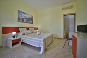 Postel nebo postele na pokoji v ubytování B&B La Casa di Attilio