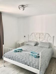Ein Bett oder Betten in einem Zimmer der Unterkunft Alisios Dream