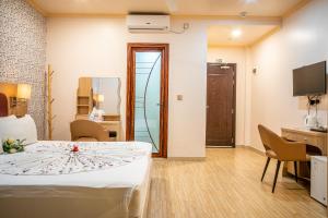 TV a/nebo společenská místnost v ubytování Sunrise Beach + 29 fotografií
