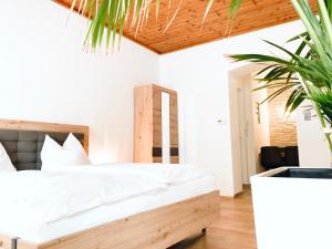 Posteľ alebo postele v izbe v ubytovaní APARTMENTS zum Wohlfühlen MARIAZELL