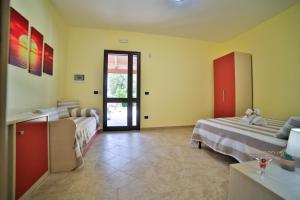 Postel nebo postele na pokoji v ubytování B&B La Casa di Attilio