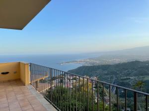a balcony with a view of the ocean at Taormina Rooms Panoramic Apartments in Taormina