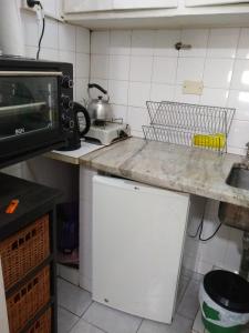a kitchen with a counter top and a microwave at DTO 1AMB. RECOLETA in Buenos Aires