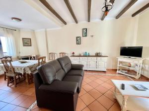 a living room with a couch and a table at Casitas Sierra de Libar in Montejaque