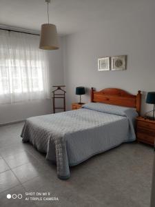 En eller flere senger på et rom på Casa Playa de Caldebarcos
