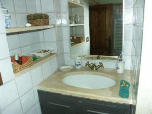 a bathroom with a sink and a mirror at Agriturismo Podere San Pietro in Montepulciano +28 photos