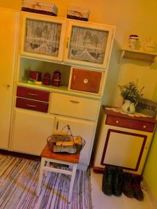 a room with a desk and a shelf with a table at Burgi`s Ferienhaus in Litschau