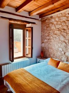 Tempat tidur dalam kamar di Alojamiento Gaia