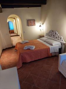 a bedroom with a bed with two towels on it at Casa Vacanze Campo de' Fiori in Rome