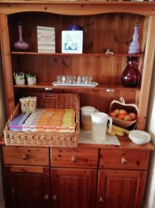 a wooden cabinet with a basket on top of it at Shirley Heights Hotel in Blackpool